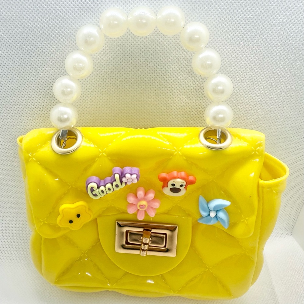 Yellow Quilted Handbag with Pearl Handle and a Gold Plated Shoulder Strap.